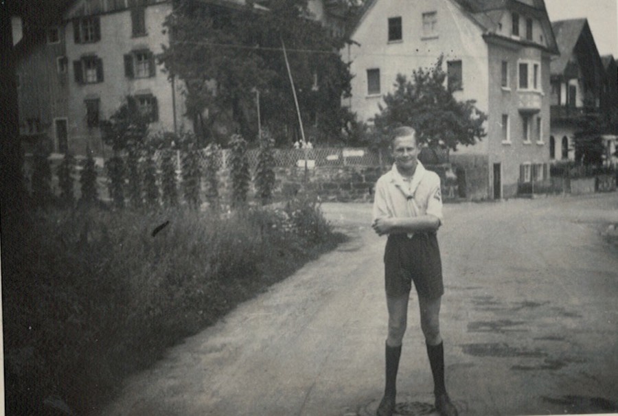 Alexander as a schoolboy on a village street