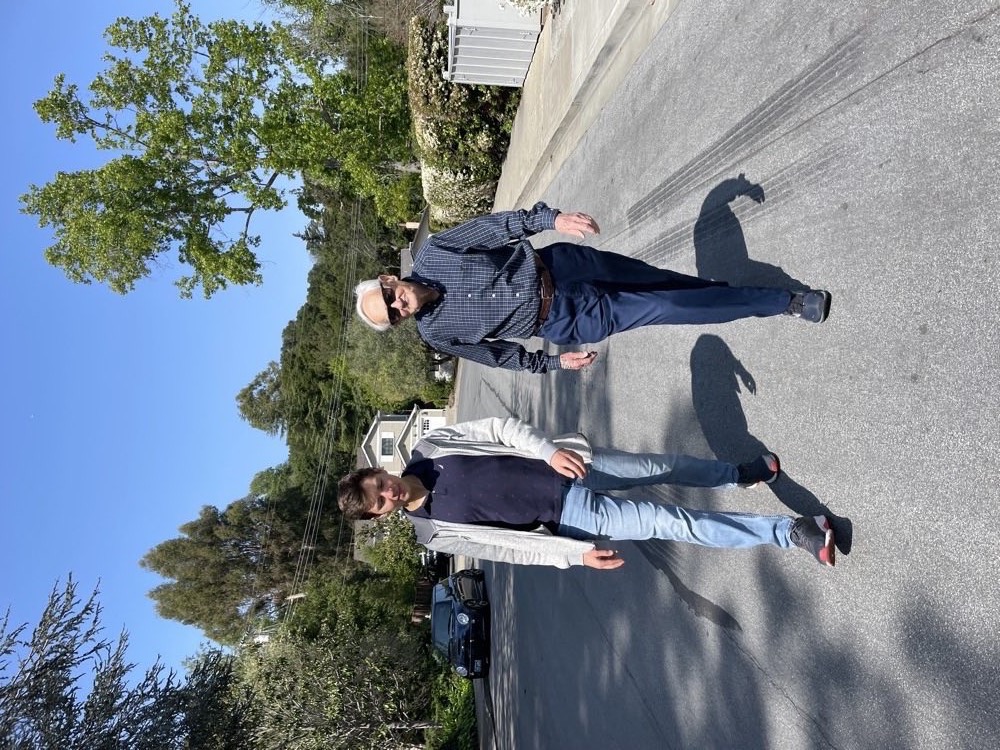 Alexander Kugushev walking down a Menlo Park street with Mark Bakunin